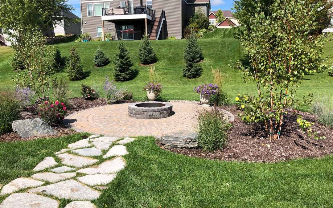 Landscaping project in Lakeville MN featuring custom paver patio installation